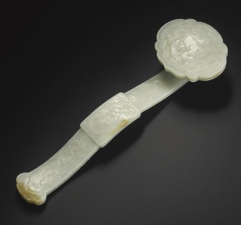 A CELADON JADE RUYI SCEPTER 19TH / 20TH CENTURY the ruyi-shaped head carved in low relief with a scholar and attendant crossing a bridge beneath pine trees, the panel centering the curved stem carved with bamboo trees, the lower half of the stem decorated with further pine trees and lingzhi, the reverse with an apocryphal Qianlong mark within a square, the stone of a pale celadon with white mottling Bamboo Trees, Chinese Aesthetic, Chinese Jade, Ancient China, A Bridge, Pine Trees, Chinese Antiques, Jade Pendant, Ancient Chinese