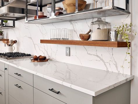 Calacatta Laza Quartz by MSI Surfaces Quartz Backsplash, Brown Kitchen Cabinets, Decoration Vitrine, Kitchen Countertop Materials, Quartz Kitchen Countertops, Kitchen Backsplash Designs, Quartz Kitchen, White Quartz Countertop, White Marble Countertops