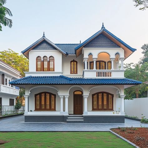 Where modern meets tradition in perfect harmony! 🏡✨ This two-story home features a striking blue-tiled roof and arched wooden windows that bring a touch of classic Indian charm to contemporary design. With its elegant white exterior and contrasting accents, this house stands out as a beacon of style and functionality. 🌿🚗 #ModernIndianArchitecture #HomeDesign #ArchitecturalElegance #TraditionalElements #ContemporaryLiving #StylishHomes #GardenViews #HomeInspiration Home Features, White Exterior, Wooden Windows, Indian Architecture, Two Story Homes, Indian Home, Perfect Harmony, Facade Design, Window Design