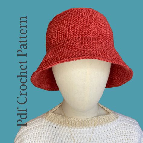 Red crocheted bucket hat with blue background Bucket Hat Crochet Pattern, Crochet Summer Hat, Bucket Hat Crochet, Summer Bucket Hat, Bucket Hat Pattern, Hat Crochet Pattern, Crochet Bucket, Crochet Bucket Hat, Crochet Summer