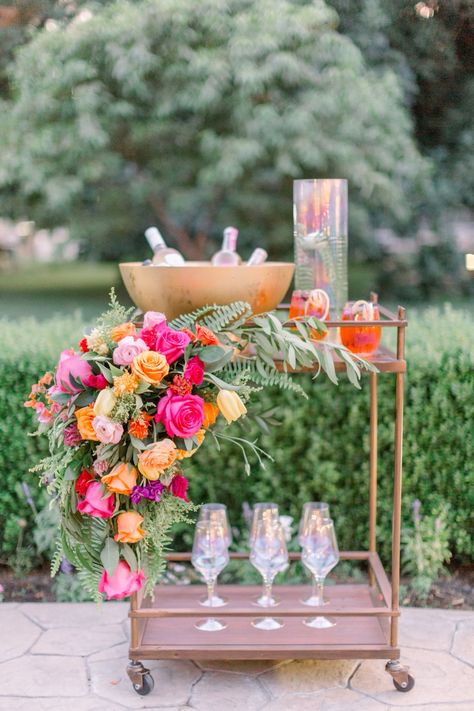 Colorful Wedding Bar Decor, Bar Cart Flowers, Hot Pink And Orange Flower Arrangements, Bright Flowers For Wedding, Pink Orange Floral Arrangements, Bright And Bold Color Palette Wedding, Bright Pink And Orange Wedding Flowers, Pink And Orange Wedding Reception, Floral Bar Cart