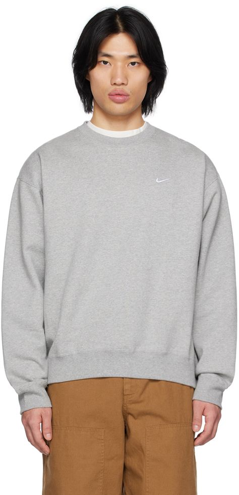 Cotton-blend fleece sweatshirt. · Rib knit crewneck, hem, and cuffs · Swoosh embroidered at chest Please note that this item may be shipped only within North America. Supplier color: Dark grey heather/White | Nike Gray Solo Swoosh Sweatshirt Nike Crewneck Outfit, Grey Crewneck Outfit, Crewneck Outfit Men, Men Sweatshirt Outfit, Crewneck Outfit, Nike Crewneck, Grey Crewneck, Men Sweatshirt, Sweatshirt Outfit