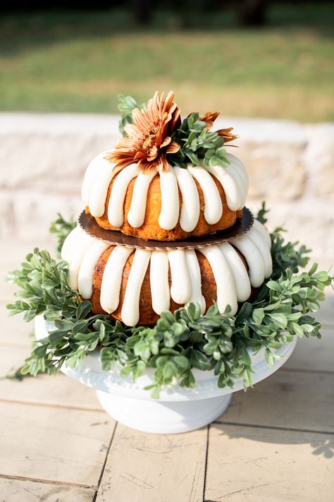 Wedding Cake tip: not a big cake person, Nothing Bundt Cakes and leftover greenery & flowers can do the trick and look amazing! #outdoorwedding #weddingceremony #weddingday #texaswedding #fallwedding #airbnbwedding #covidwedding #smallwedding #dreambackyardwedding #oncloudnunez Everything Bundt Cakes, Bundt Cake Decorations, Greenery Flowers, Cake Centerpieces, Big Cake, Nothing Bundt, Nothing Bundt Cakes, Wedding Cake Table, Simple Wedding Cake