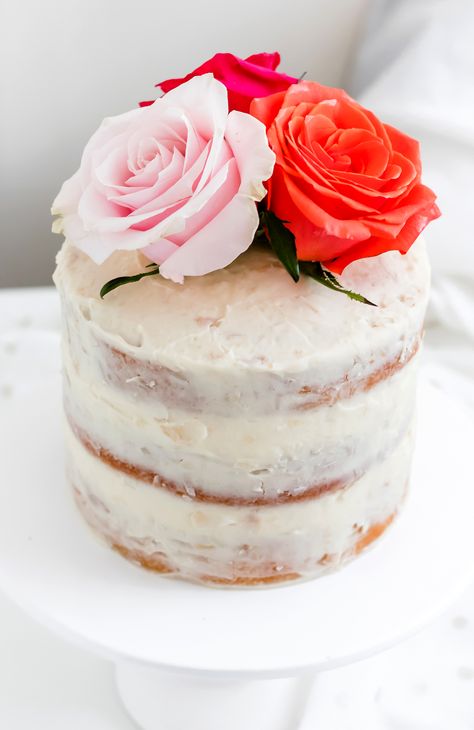 Three layers of tender coconut cake are layered between a white chocolate coconut filling - this White Chocolate Coconut Almond Layer Cake is an all-time favorite! #layercake #coconutcake #almondcake #whitechocolate #valentinesdaydessert #dessert #cake #bakedambrosia Fresh Flowers On A Cake, Flowers On A Cake, Almond Layer Cake, White Chocolate Coconut, Cake With Fresh Flowers, Fresh Flower Cake, Dark Chocolate Cakes, Coconut Almond, Cake Cover