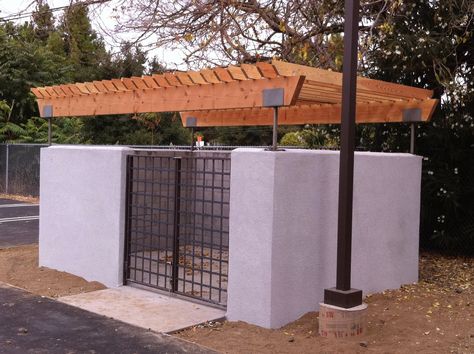 Mountain View, CA commercial trash enclosure with redwood arbor and steel gates Dumpster Enclosure, Garbage Enclosure, Trash Enclosure, Steel Gates, Diy Wedding Arch, Garbage Storage, Events Place, Front Garden Landscape, Spanish Architecture