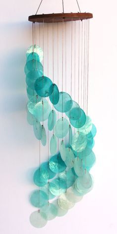 Turquoise Spiral Cascading Capiz Shell Chime Capiz Shell Crafts, Shell Lighting, Capiz Wind Chimes, Luminaria Diy, Capiz Shell Chandelier, Wind Chimes Homemade, Shell Wind Chimes, Shell Mobile, Diy Wind Chimes