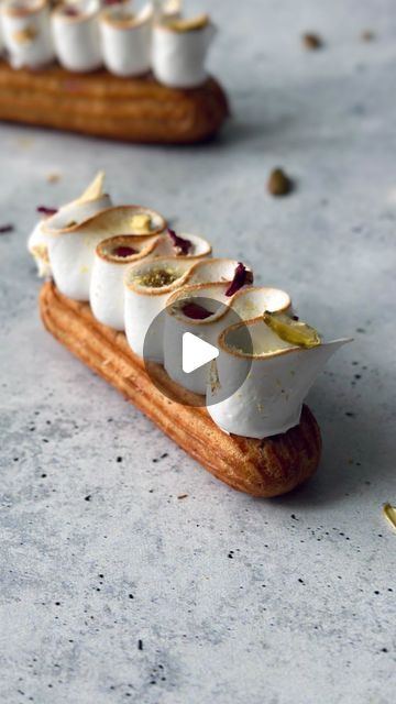 Fred Csibi-Levin | Doc Macaron on Instagram: "(Recipe) Raspberry, Pistachio Meringue Éclairs, filled with raspberry crémeux (recipe below) and pistachio praliné, topped with Italian meringue. 

> Perforated mats from @sashacakeschicago

RASPBERRY CRÉMEUX:
*85g raspberry purée 
*55g granulated sugar, divided in 2
*2 egg yolks 
*100g white chocolate. I used @stoverandcompany 33% couverture.
*20g butter
*Pinch of salt
For a slightly thicker crémeux add 1 gelatin sheet (or 2.5g powder) and 40g of additional butter.

THE PROCESS IN THE COMMENTS

#eclair #chouxpastry #pateachoux #patisseriefrancaise #pâtisserie #raspberry #framboise #pistachio #praline #pistache #ganache #meringue" Pistachio Eclair Dessert, Raspberry Pistachio Eclairs, Raspberry Entremet, Raspberry Eclairs, Pistachio Paris Brest, Italian Meringue, Choux Pastry, Egg Yolk, Eclairs