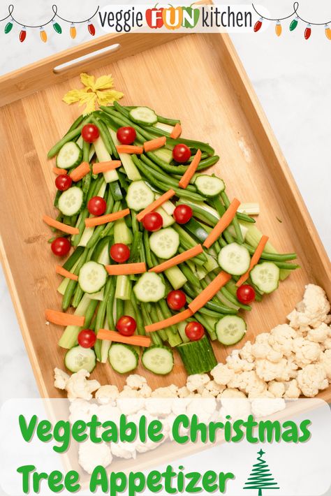 This festive Christmas Tree Appetizer is fun and easy to make with fresh vegetables like pea pods, green beans, celery, carrots, and bell peppers. Decorate the veggie Christmas tree with cherry tomatoes and cucumber, all "standing" on a bed of cauliflower. Choose your favorite dips and sauces (see below) to complete this yummy Christmas tree vegetable tray. Vegetable Christmas Tree, Veggie Christmas Tree, Vegetable Christmas, Turkey Fruit Platter, Christmas Tree Appetizer, Tree Appetizer, Christmas Veggie Tray, Christmas Pasta, Veggie Christmas