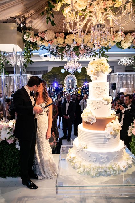 Amanda surprised Bennett with this monogrammed sword as a nod to rapper Gucci Mane, who also cut his wedding cake with a sword. “It was supposed to be a joke, but then he wouldn’t put it down!” Amanda laughs.#DWeddings #DallasWeddings #SixTieredCake #GucciMane #ToddEvents #FancyCakes Garden Themed Wedding Dress, Untraditional Wedding Cakes, Swords Wedding, Moodboard Wedding, Armenian Wedding, Lebanese Wedding, Forest Theme Wedding, Wedding Aesthetics, Dream Wedding Cake