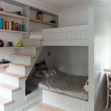 This children's room has a modern look with tongue-and-groove panelling and pale wood flooring, but stars of the show are the innovative built-in bunk beds, which incorporate a den-like lower bunk, a top-of-the-world upper, plus mini staircase (don't insult us with a ladder!) and integrated book shelving. Small Kids Bedroom, Apartemen Studio, Trendy Nursery, Children's Bedroom Ideas, Modern Bunk Beds, Bunk Rooms, Bunk Beds With Stairs, Bunk Bed Designs, Kids Bunk Beds