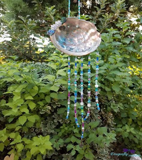 I've always wanted to make an Abalone Shell Sun Catcher with one of the many Abalone Shells I have. A lot of the projects in my mind get pushed to the bottom of the list, but I managed to carve bits of time here and there and finally completed it! Be sure it's clean    I had an idea of what I wanted it to look like and just kind of winged it.I receive them cleaned, but did give a gentle scrub with toothpaste and toothbrush. They all are so gorgeous! Basically, you need just 3 supplies… Diy Cabinet Doors, Bar Soap Holder, Grandmother Jewelry, Aqua Beads, Seashell Crafts, Brother In Law, Mom Jewelry, Crackle Glass, Shell Art