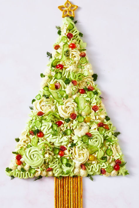 If there's one family event in the annual calendar that I can't wait for, it's Christmas. And no, it's not the promise of presents that keeps me up at night with thousands of colourful images flashing before my eyes... it's festive platters!  Introducing the ultimate Christmas lunch addition: the Christmas tree dip board.  You may remember when butter boards were taking over TikTok and Instagram, but dip boards are where it's at for this festive season! Christmas Tree Butter Board, Christmas Tree Dip, Christmas Finger Food, Decorated Pretzels, Dip Board, Butter Boards, Christmas Finger Foods, Summer Punch, Butter Board