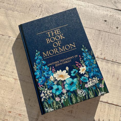 A Beautiful commissioned Book of Mormon 🦋🪻🌸🪷 Tree Of Life Book Of Mormon, Decorating Book Of Mormon Cover, Book Of Mormon Cover Art, Book Of Mormon Painting, Book Of Mormon Art, Book Of Mormon Painted Cover, Painted Book Of Mormon, Book Of Mormon Scriptures, Scripture Study Lds