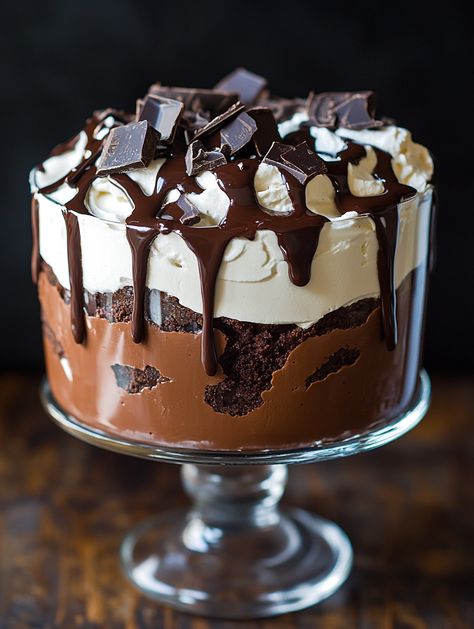 Bailey's Chocolate Cheesecake Trifle with Chocolate Drizzle

🍫 𝗜𝗻𝗴𝗿𝗲𝗱𝗶𝗲𝗻𝘁𝘀 🍫 
For the base:
1 package (14 ounces) chocolate sandwich cookies
5 tablespoons unsalted butter, melted
For the cheesecake layer:
16 ounces cream cheese, softened
1 cup granulated sugar
1/4 cup unsweetened cocoa powder
1/4 cup milk
1 teaspoon vanilla extract
1/4 cup Bailey's Irish Cream
For the whipped cream layer:
1 container (8 ounces) frozen whipped topping, thawed Chocolate Cheesecake Trifle, Baileys Chocolate Cheesecake, Chocolate Strawberry Cheesecake, Brownie Trifle, Cheesecake Trifle, Cheesecake Layer, White Chocolate Strawberries, Nutella Cake, Caramel Brownies