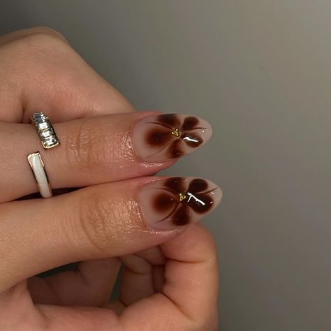 fall set🦦 @roubie_s • • using @apresnailofficial médium sculpted almond • • • • #nailsbyrosane #nails #nailsmtl #nailtech #nailtechmtl #ongles #gelxnails #apresgelx #mtl #ignails #simplenails #frenchtipnails #nailart #nailinspiration #prettynailssalon #evileye #man #manicure #natural #haileybieber #chrome #fallnails #brown #brownnails #fallset #falldesign Brown Flower French Tip Nails, Brown Blooming Nails, Brown Flowers Nails, Brown Blooming Gel Nails, November Short Nails, Brown Nails With Flowers, Brown Nails With Chrome, Brown Flower Nails, Man Manicure