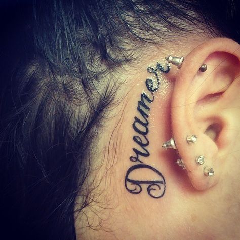 32 Tattoos Behind the Ear – The Pros and Cons Name Tattoos Behind The Ear, Name Tattoos Behind Ear Men, Behind The Ear Name Tattoo Ideas, Tattoo Name Behind Ear, Name Behind Ear Tattoo Men, Behind Ear Tattoo Men Words, Ear Tattoo Name, Words Behind Ear Tattoo, Behind The Ear Name Tattoo