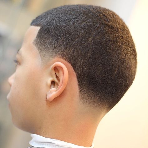 buzzcut and whitewalls Buzzcut Taper Fade, Low Taper Buzzcut, Fade Bajo, Fade Haircut Curly Hair, Black Men Beard Styles, Boys Haircut Styles, Men Fade Haircut Short, Black Hair Cuts, Taper Fade Haircut