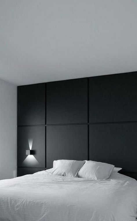 a minimalist bedroom with a black paneled wall for an accent and all neutrals around is a chic and cool space with a calm feel Interior Design Minimalist, Black Interior Design, Dekorasi Kamar Tidur, Mid Century Modern Interiors, 아파트 인테리어, Trendy Bedroom, Bedroom Ceiling Light, Minimalist Bedroom, Home Staging