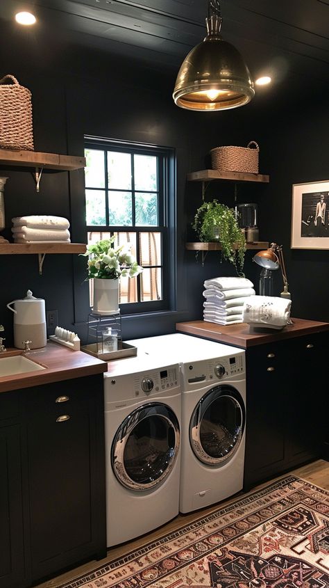 Looking to upgrade your laundry room? 🧺 Explore 40+ of the best laundry room ideas to inspire you! From sleek and modern designs to functional and organized spaces, these ideas will help you create a stylish and efficient laundry area that makes chores a breeze. Whether you have a small nook or a spacious room, find the perfect inspiration to transform your laundry space into something you'll love. #LaundryRoom #HomeOrganization #InteriorDesign #LaundryRoomInspiration #HomeDecor Laundry Black Cabinets, Laundry Room Ideas Industrial Style, Laundry Room Ideas Black Cabinets, Diy Laundry Room Renovation, Dark Blue Laundry Room Walls, Dark Rustic Laundry Room, Industrial Laundry Room Design, Black Ceiling Laundry Room, Moody Vintage Laundry Room