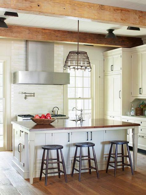 In this kitchen, a walnut countertop mimics an antique farmhouse table. More vintage-inspired ideas here: http://www.bhg.com/kitchen/styles/country/vintage-inspired-farmhouse-kitchen/?socsrc=bhgpin061214farmhousecharacter&page=2 Island With Storage And Seating, Kitchen Island Storage Ideas, Walnut Countertop, Dapur Rustic, Kitchen Island With Storage, Island With Storage, Storage And Seating, Island Storage, Kitchen Island Storage