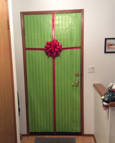 Present Wrapped Door, Gift Wrapped Door Christmas, Wrapping Paper On Door, Christmas Wrapping Paper Wall, Christmas Door Wrapping Paper, Wrapping Paper Door, Door Wrapped Like Present, Wrapping Paper Front Door Christmas, Front Door Wrapped Like A Christmas Present