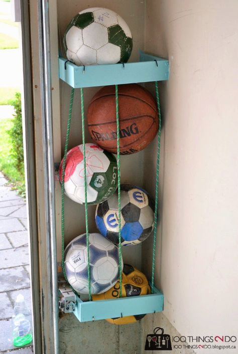 Tuck them around two 2x4 boxes to organize all of the sports balls taking up space in your garage. | 35 Brilliant Ways Bungee Cords Can Solve All Your Problems Garage Hacks, Outdoor Toy Storage, Sports Equipment Storage, Storage Hacks Diy, Diy Toy Storage, Diy Organizer, Garage Storage Solutions, Ball Holder, Tool Storage Diy