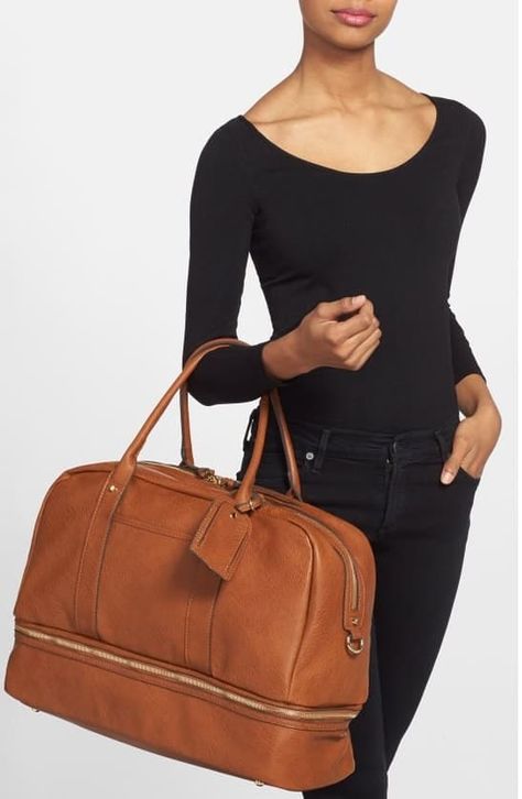 It also has a two-way zip closure, removable handles, an adjustable shoulder strap, and multiple pockets. Get it from Nordstrom for $89.95 (available in five colors). Holdall Bag, Leather Weekender Bag, Leather Weekender, Faux Leather Bag, Halloween Bags, Weekend Bag, Celine Luggage Bag, Sole Society, Travel Tote