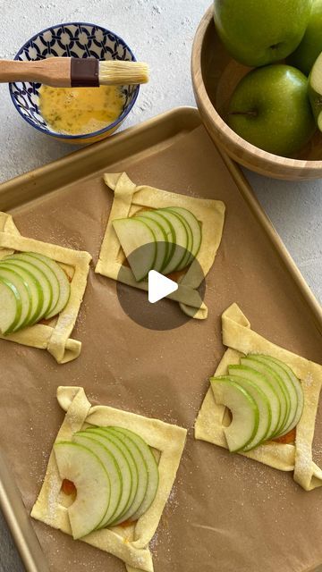 Sivan's Kitchen on Instagram‎: "RECIPE BELOW ⬇️

5 simple ingredients for this beautiful and super delicious apple 🍏 puff pastry dessert. 
Made in minutes and so easy, perfect for your upcoming #roshhashana dinner. I love how it’s individual too 💚

Ingredients: 
•puff pastry squares 
•apricot preserves 
•green apples 
•1 beaten egg 
•sugar in the raw or coarse granulated sugar 

Thaw your puff pastry, for best results thaw in refrigerator. Fold your square into a triangle without pressing down. Slice down one side and then the other (like In the reel) make sure not to tough the cuts together. You want to leave a gap in between the cuts. Open up your square and now cross the flaps and press down neatly. Place a teaspoon of preserves in the center  of your square and spread it around. Remo Green Apple Puff Pastry Recipes, Apple Recipes With Puff Pastry, Sivan's Kitchen, Pastry Squares, Puff Pastry Dessert, Apricot Preserves, Apple Puff Pastry, Puff Pastry Desserts, Caramel Drizzle