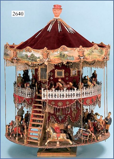 Huge two-story toy carousel. Size: 82 cm high, 60 cm diam. Ca. 1900 Made from wood / dough figurines, horse riders, benches, Zinngeländer, velvet walls, embroidered beads, paneling, painted pressboard. Toy Carousel, Victorian Toys, Musical Box, Carousel Horses, Merry Go Round, Tin Toys, Antique Toys, Rocking Horse, Old Toys