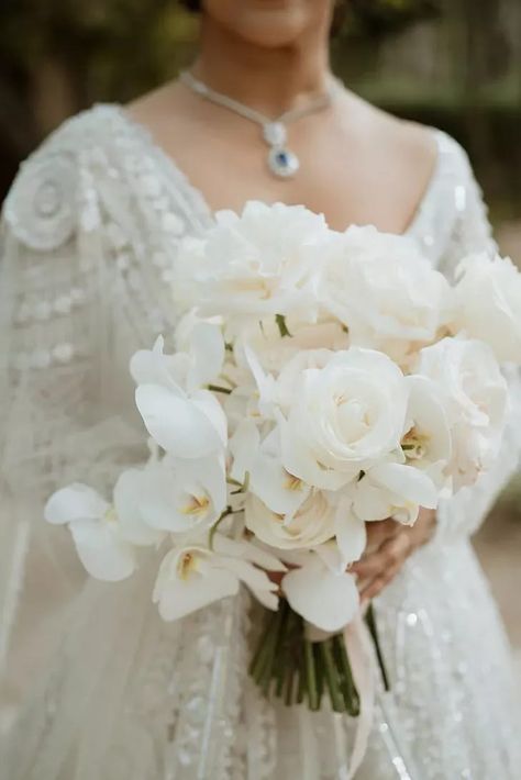 All-White Wedding Bouquet With Roses and Orchids White Rose And Orchid Wedding Bouquet, White Rose Orchid Bouquet, Rose And Orchid Bridal Bouquet, Roses And Orchids Bouquet, Modern White Bouquet, Rose Orchid Bouquet, Orchid Rose Bouquet, Orchid And Rose Bouquet, Rose And Orchid Bouquet