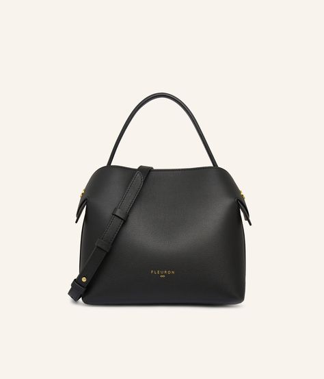 The Medium Swan bag in Black, crafted from smooth calf leather, embodies a timeless elegance that perfectly adapts to all your outfits, whether they are understated or boldly colored. Its optimal size offers sufficient space for all your daily essentials, while maintaining an elegant and streamlined silhouette. Black, as a universal and timeless color, elegantly pairs with a wide palette of colors. It harmoniously combines with neutral tones such as beige, sand, or grey, creating a classic and refined look. For a touch of boldness, pair it with vibrant colors like brick red, mustard yellow, or electric blue. Carefully made in Italy, the Medium Swan bag in black is distinguished by its discreet metallic finishes and sophisticated allure. Versatile, it can be worn in various ways: by hand,