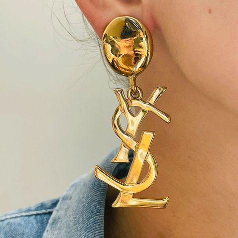 The quality of these iconic earrings is fantastic, the chandelier YSL logo makes it a real statement. Crafted in high carat gold plated metal with original secure clip on fastenings, these XL earrings come in their original YSL box. A true fashion collectable!