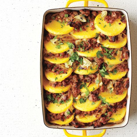 Here, the polenta is already made -- just bake this flavorful blend of sausage, artichokes and onions with it, and serve like a lasagna. Polenta Casserole, Artichoke Heart Recipes, Baked Polenta, Dinner Casserole Recipes, Polenta Recipes, Martha Stewart Recipes, Egg Plant, Veggie Meals, Sweet Italian Sausage