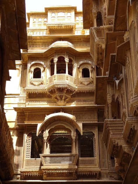 Jaisalmer Fort in Rajasthan.The Patwon Ji ki Haveli is the most important among the havelis in Jaisalmer.This is precisely because of two things,1st that it was the 1st haveli erected in Jaisalmer&2nd,that it is not a single haveli but a cluster of 5 small havelis. The 1st among these havelis was commissioned&constructed in the year 1805 by Guman Chand Patwa&is the biggest&the most ostentatious.It is believed that Patwa was a rich man&was a renowned trader of his time. Jaisalmer Fort, Who Is A Mother, Traditional Illustration, Ancient Indian Architecture, Jaisalmer, Indian Architecture, Rich Man, North Africa, African Art