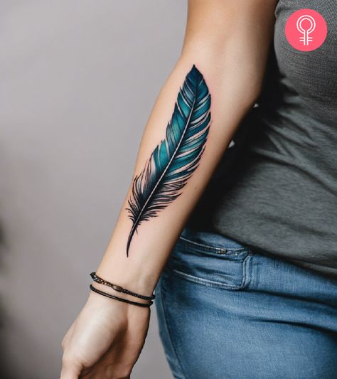 8 Simple Feather Tattoo Ideas With Inspiring Meanings Sleeve Tattoos Feathers, Peacock Feather Tattoo Black And Grey, Tiny Feather Tattoo Wrist, Feather Tattoo On Hand For Women, Feather With Butterfly Tattoo Design, Colorful Feather Tattoos For Women, Blue Bird Feather Tattoo, 3 Feathers Tattoo, Magpie Feather Tattoo