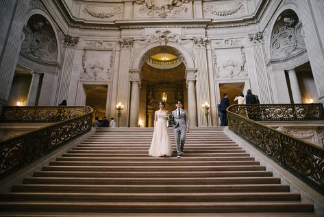 Couple walks down the grand stair case at San Francisco City Hall.  This eloping couple travelled from out of town to get married at City Hall.   It was just the two of them.  Many couples bring more than the 6 guest limit which can be a problem.  Check out my advice and tips for having a civil ceremony at San Francisco City Hall. City Hall Wedding Photography, City Hall Wedding Photos, Sf City Hall Wedding, San Francisco City Hall Elopement, San Francisco City Hall Wedding, San Francisco City Hall, City Hall Wedding, San Francisco City, Wedding Vendor