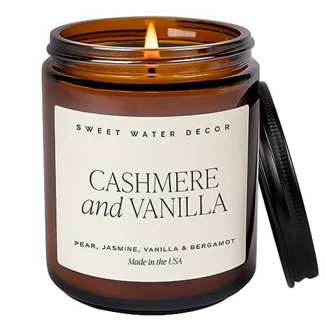 Aromatherapy meets luxury in our Cashmere and Vanilla soy candle. The rich, creamy aroma of milky coconut and bourbon vanilla meets the warmth of soft cashmere and sandalwood, with just a touch of musk in this decadent candle. Hints of Frangipani add exotic floral notes to round out our newest luxurious and timeless scent that everyone will love. Wood Scented Candles, Water Decor, Amber Jar Candle, Amber Candle, Fall Candle Scents, Candle Quotes, Sweet Water, Amber Jars, Holiday Scents