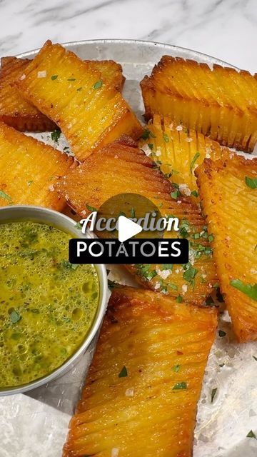 Isabelle Dunn | French Recipes on Instagram: "ACCORDION ROASTIES 🥔🇫🇷 Recipe below👇🏼

These accordion-shaped potatoes are like hasselbacks, but even better! They’re super tasty and fun to pull-apart and nibble on!

📍SAVE this post to make it later 🫶🏼
6 large potatoes 
40g butter, melted 
2 tbsp parsley, finely chopped 
Salt and pepper to taste 

⭐️Preheat the oven to 200℃ (180℃ fan-forced). Cut the potatoes into rectangles (about 2 per potato) and slice one side vertically and the other side diagonally. To prevent cutting all the way through, place chopsticks on either side of the potato as a guide. 
 
⭐️Brush the potatoes with melted butter and season generously with salt and pepper. Roast for 45 minutes, basting with pan juices and flipping every 15 minutes. Before serving, sprink Accordion Sweet Potatoes, Accordion Potatoes Air Fryer, Scored Parmesan Potatoes, Roasties Recipe, Spanish Style Roasted Potatoes, Accordion Potatoes, Accordion Potato, Hasselback Potatoes, French Recipes