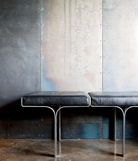 An aluminum bench harmonizes with the industrial nature of the galvanized-steel walls and the polished concrete floor within a metal broker's Collingwood, Ontario, house. Photo by Lorne Bridgman. Metal Facade, Design Industrial, Polished Concrete, Furniture Details, Steel Wall, Interior Furniture, Concrete Floors, Interior Spaces, Interior Details