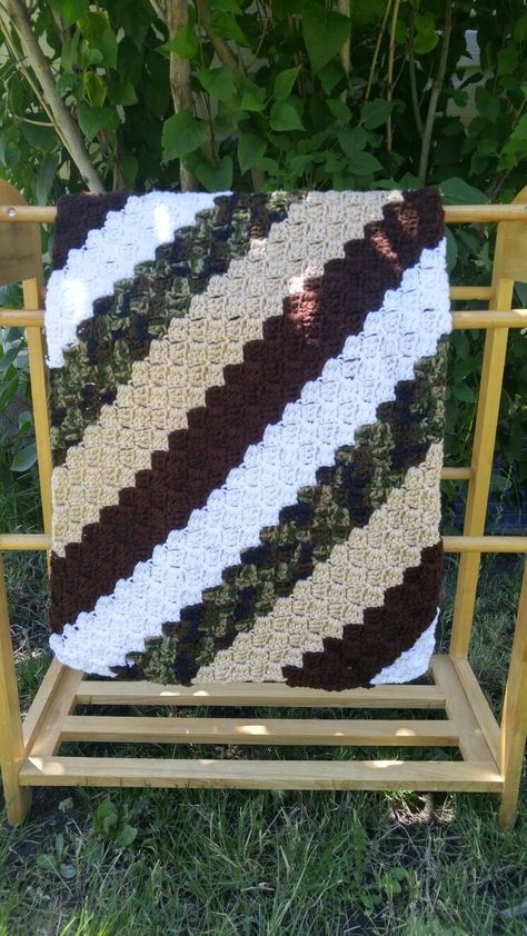 "Diagonal striped camouflage crocheted baby blanket This would be a special gift for or a new little baby or toddler, a loved one going through chemo in the hospital, the wheelchair bound/elderly, or for yourself! Military family? Perfect! An army wife myself, this blanket it dedicated to the men and women who fight for our freedom. Price varies depending on size below:  $45 Small - approx 25\" X 25\" (Security blanket/Small lap blanket) $60 Medium - approx 35\" X 35\" (Stroller blanket/lap blan Camo Crochet Blanket, Large Knit Blanket, Amigurumi Shark, Military Baby, Crochet C2c Pattern, Diy Knit Blanket, Crocheted Blankets, Striped Baby Blanket, Crocheted Baby Blanket