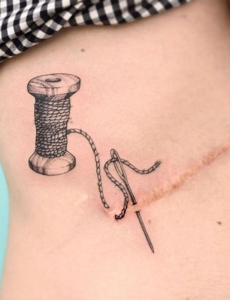 Sewing Needle Tattoo Design, Needle And Thread Tattoo Scar, Mastectomy Scar Tattoo Ideas, Scar Tattoos Coverups, Tattoo Over Scar Ideas, Ostomy Tattoo, Back Scar Tattoo, Stretchmark Cover Tattoos, Breast Reduction Scar Tattoo