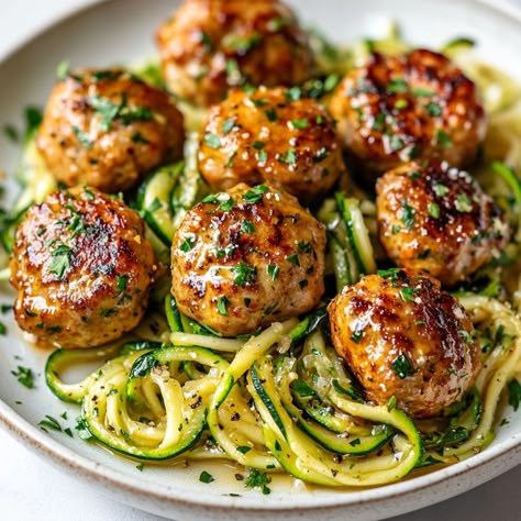 Garlic Butter Turkey Meatballs with Zucchini Noodles - Yeyfood.com: Recipes, cooking tips, and kitchen hacks for home cooks of all levels Meatballs And Zoodle, Cheesy Garlic Burgers & Zucchini Noodles, Turkey Meatballs Zoodles, Zoodles And Turkey Meatballs, Garlic Butter Meatballs With Zoodles, Zucchini And Meatballs, Zucchini Noodle Meals, Recipes With Zoodles, Zoodles Recipe Healthy