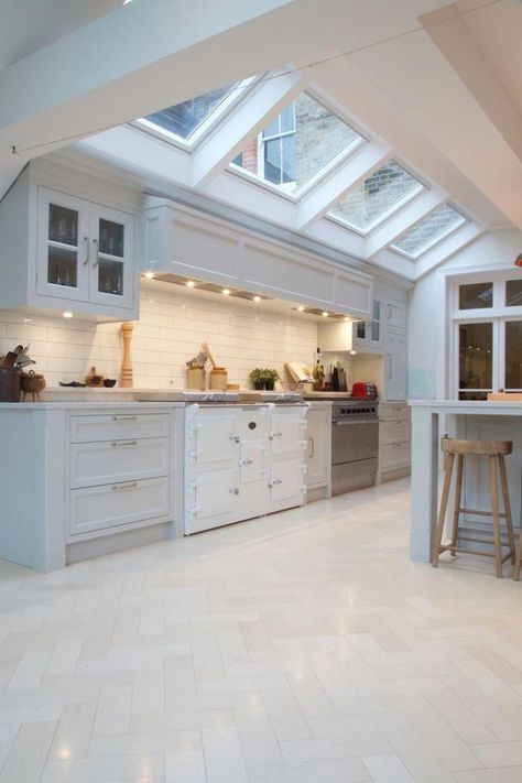 A traditional white kitchen with herringbone white tile flooring, a custom hood and range with skylights for added interior light. #kitchenideas #kitchendesign #kitchenflooring #kitchenflooringwithwhitecabinets Herringbone White Tile, White Kitchen Floor, White Kitchen Traditional, White Tile Floor, White Kitchens, White Kitchen Design, White Floors, Kitchen Floor Tile, Modern Farmhouse Kitchens