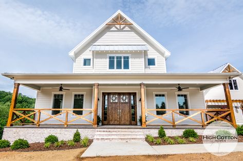 Front Porch Rails Ideas Farmhouse, Farmhouse Concrete Porch, Stained Wood Porch Railings, Wood Beams Front Porch Farmhouse, Farmhouse Porch Railing Wood, Farmhouse Porch With Railing, White Farmhouse Porch Railing, Cedar Front Porch Railing, Wrap Around Porch Railing Farmhouse