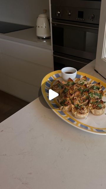 Sophie Fisher on Instagram: "chicken dumpling cups 🥟🥟the perfect party starter or snack. They’re quick and easy to whip up and bigggg on flav. Thanks for the inspo @seriousfoodfetish 🤍

-dumpling cups 
12 wonton wrappers
500g chicken mince
1 1/2 tbsp soy sauce
1/2 tbsp sesame oil
2 tsp fish sauce
1 tsp minced garlic
1 tsp minced ginger
2 tbsp chives, finely chopped
2 tsp sesame seeds

-dipping sauce
1 tbsp sweet chilli sauce
1 tsp sesame oil
1 tbsp soy sauce 
1 tbsp rice wine vinegar

Chilli oil, to serve 
Fresh coriander, finely chopped

Preheat oven to 200C. Grease a 12 pan muffin tin with olive oil. Place wonton wrappers in the centre of each hole. Meanwhile, in a bowl add the chicken mince, soy sauce, sesame oil fish sauce, garlic, ginger and chives, Mix well. Scoop the mixture into Dumpling Cups, Chicken Dumpling, Chicken Mince, Chicken Wontons, Chilli Oil, Party Starters, Sushi Time, Sweet Chilli Sauce, Wonton Wrappers