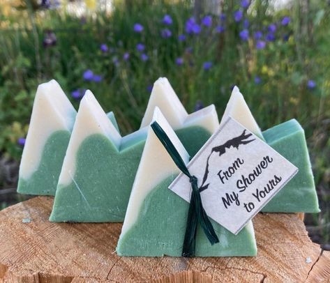 "Personalized Mountain Favors is the perfect complement for your destination outdoor wedding, bridal shower guests, baby shower, gender reveal party favors, airbnb, gift baskets, vrbo, or any event.   Our original Mini Soap (2\" or more high and 1.5 oz) will be LOVED by your guests.  These adorable snow-capped mountains with your custom tag is a sweet way to say \"Thank You\". NEW!  Lovely Scents to choose from: Mountain Meadow -  very pleasant sweet scent Northwoods - nice woodsy scent  Green T Adventure Awaits Party Favors, Pine Tree Bridal Shower Ideas, Mountain Theme Wedding Favors, Nature Themed Wedding Favors, Mountain Wedding Favors For Guests, Mountains Bridal Shower Theme, National Park Wedding Favors, Bridal Shower Outdoor Theme, Nature Themed Bridal Shower Ideas