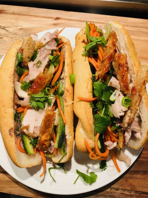 Recreate these delicious crispy pork bahn mi rolls at home with my easy to follow recipe. Also known as a bahn mi sandwich. All you need is leftover pork roast and a few other simple ingredients and you will be fighting into these mouthwatering bahn mi rolls. A classic Vietnamese street food. Hear the crunch in every bite. the ultimate fakeaway. The crispy pork, fresh herbs and pickled carrot make these traditional pork rolls irresistible. Roast Pork Banh Mi, Vietnamese Roast Pork, Pork Belly Bahn Mi Sandwich, Pork Roll Sandwich, Pork Roll Recipes, Bahn Mi Pork, Pork Bahn Mi Sandwich, Pork Belly Bahn Mi, Pork Banh Mi Sandwich