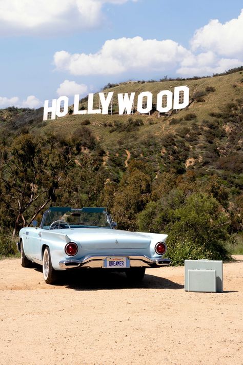 Chase your dreams in Welcome to Hollywood Vertical from Gray’s vintage-inspired series Welcome to Hollywood. This photograph features a 1957 Ford Thunderbird. HOLLYWOOD® & Design ©2023 HCC. All Rights Reserved. Hollywood Romance Aesthetic, Old Hollywood Sign Aesthetic, Hollywood 70s Aesthetic, Old Hollywood Flowers, Old Hollywood Glam Aesthetic, West Hollywood Aesthetic, Retro Hollywood Aesthetic, Old Hollywood Event, Hollywood Sign Aesthetic