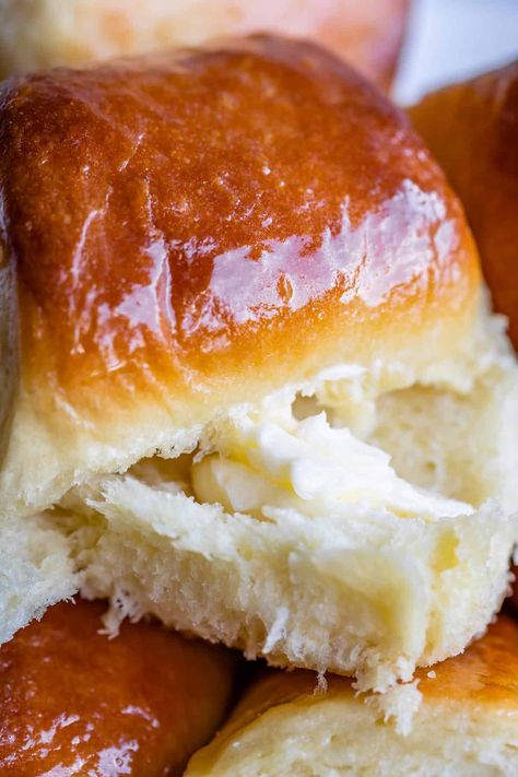 Soft and Fluffy Parker House Rolls from The Food Charlatan. These homemade Parker House Rolls are unbelievably soft and fluffy! A rich, buttery dough with potato flakes results in that cloud-like, puffy texture you love. The swirl of butter in the center of these dinner rolls makes them completely irresistible! You can even make this recipe ahead of time for Thanksgiving. #recipe #easy #pullapart #parkerhouse #rolls #dinnerrolls #fluffy #soft #yeast #makeahead #original #best #frozen A Cozy Kitchen Parker House Rolls, Salted Honey Parker House Rolls, Best Parker House Rolls Recipe, Parkerhouse Rolls, Vegan Parker House Rolls, Garlic Butter Parker House Rolls, Parker House Rolls, Rolls Easy, Instant Potatoes