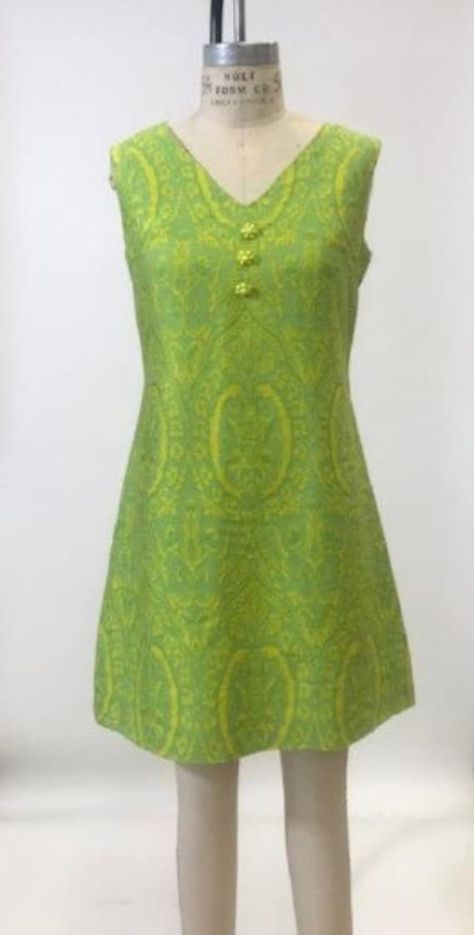 Adoreable 1960s Lime Green 1005 Silk Jaquard A-Line Sheath Dress. This cute little frock has the most amazing electric color, above the knee length with center back zipper closure.  Bead Button detailing on the front. In great condition for its age! Size 4/6 1960s Glam, Mod Green A-line Dress, Green 60s Dress, 60s Beaded Dress, 1960s Shift Dress, 70s Mode, Tyler Moore, 1960s Floral Dress, 60s 70s Fashion